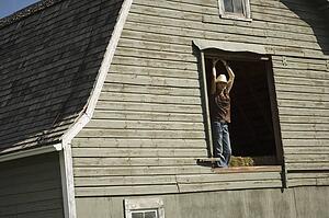 Young woman in barn loft