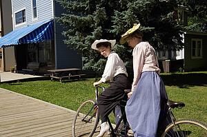 Women riding a tandem bicycle