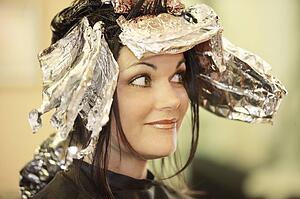 Woman having her hair dyed