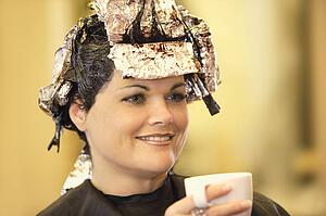 Woman having her hair dyed
