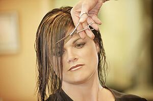 Woman having her hair cut