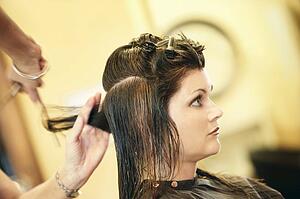 Woman having her hair cut