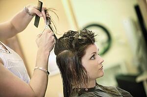 Woman having her hair cut