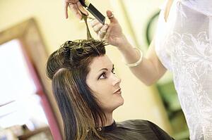 Woman having her hair cut