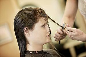 Woman having her hair cut