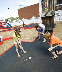Children playing mini golf