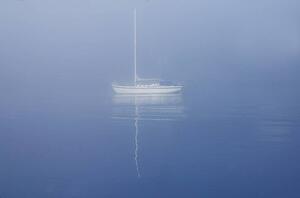 Sailboat drifting on water