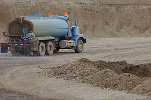 Water truck on dirt road