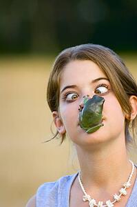 Girl with frog on her face