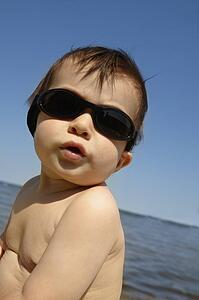 Baby boy by the lake
