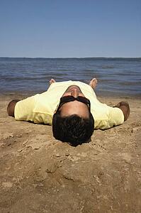 Man lying on beach