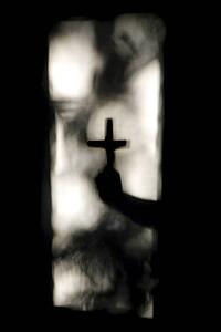 Hand holding cross 