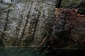 Rocks towering over water