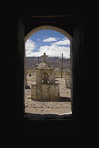 View of grave through window, Guallatire, South America