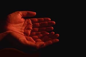 Hands open to receive