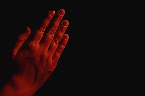 Hands together in prayer