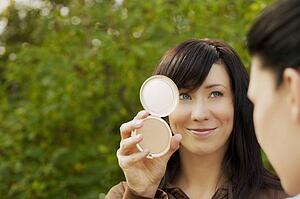Woman looking in a mirror