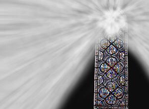Chartres cathedral stained glass window with light shining through
