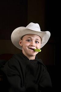 Boy eating a celery stick