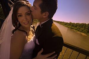 Groom kissing bride