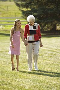 Grandmother and granddaughter holding hands