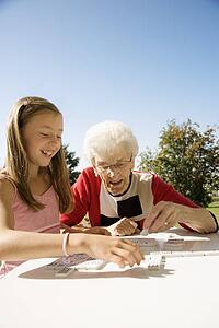 Grandmother and granddaughter playing a game