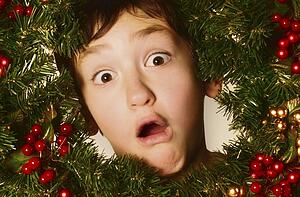 Boy in a Christmas wreath