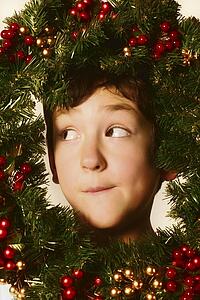 Boy in Christmas wreath