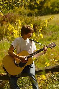 Teen playing guitar