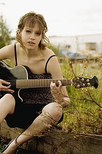 Woman playing guitar
