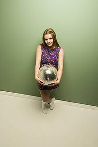Woman holding a disco ball