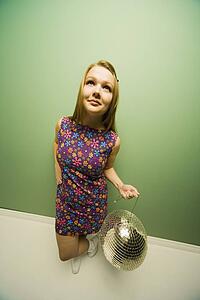 Woman holding a disco ball