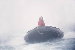 Woman riding a raft