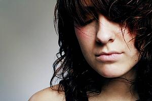 Woman with her eyes closed