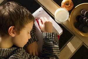 Student falls asleep on his notebook