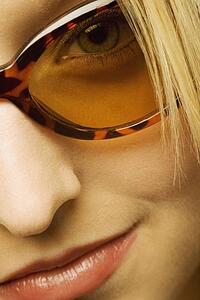 Extreme close up of woman wearing sunglasses