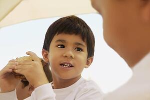Boy eating a sandwich