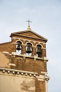 Church belfry with three bells in Venice, Italy.