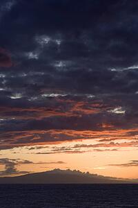 Sunset over Pacific Ocean with clouds in Maui, Hawaii, USA.