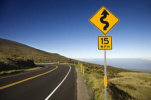 Curvy road sign in Haleakala National Park, Maui, Hawaii.