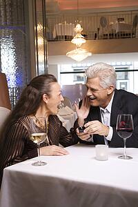 Caucasian mature adult male proposing to prime adult female.