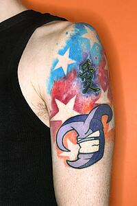 Young adult Caucasian male with tattoos on shoulder.