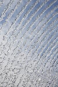 Abstract streams of water from fountain.