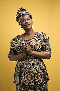 African American female mature adult in African dress.