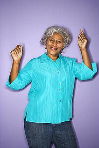 Mature adult African American female dancing.