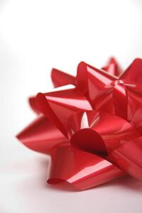 Still life of big red Christmas bow.
