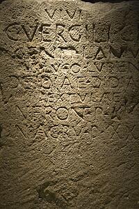 Script carved in stone in Capitoline Museum, Rome, Italy.