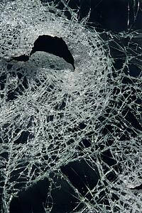 Cracked glass against black background