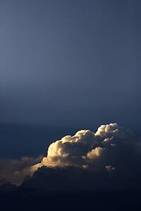 Sun peeking through clouds.