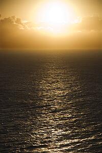 Sun reflected on ocean in Maui, Hawaii.